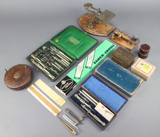A morse key, a pair of wooden and brass postage scales, 2 field geometry sets, a Faber Castell slide rule and various other drawing instruments etc, curios etc