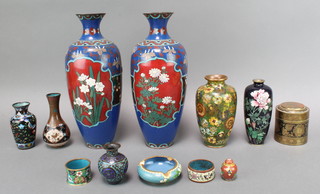 A black ground cloisonne enamelled vase with floral decoration 6" (cracked to the base), a pair of 19th Century Japanese blue ground and floral patterned cloisonne enamelled vases 11 1/2"  (f) and 4 other cloisonne enamelled vases, a miniature jar and cover, ashtray and 2 napkin rings
