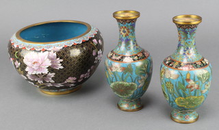 A pair of club shaped green ground and floral patterned cloisonne enamelled vases 6" (both dented) and a black and floral patterned cloisonne enamelled jardiniere 4" x 6" 