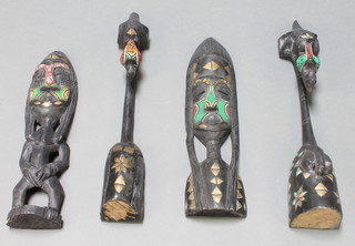 Two African carved ebonised figures with bead work decoration 24" together with 1 other pair of figures 21"  