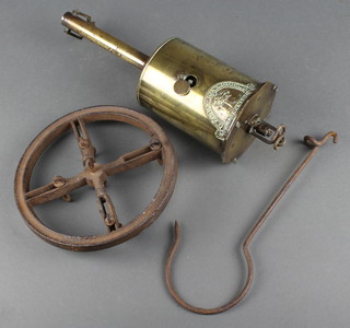 A John Linwood brass bottle jack complete with circular iron spit and hook 