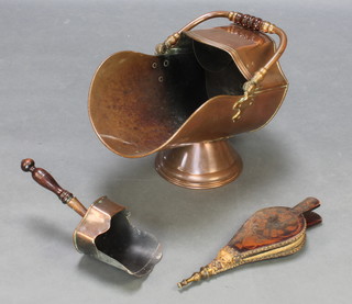 A Victorian copper shaped coal scuttle with associated shovel and a small pair of inlaid mahogany bellows