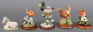 A Border Fine Arts Mallard A6504 4 1/2", a do. robin on trowel by Russell Willis 541559 3 1/2", do. robin A0408 3", a red squirrel M27 3 1/2" and a foal FF7 2 1/2" 