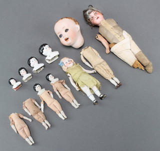 Armand Marseille, a porcelain headed doll incised Armand Marseille Germany  39041210XM together with 4 small porcelain dolls heads etc 