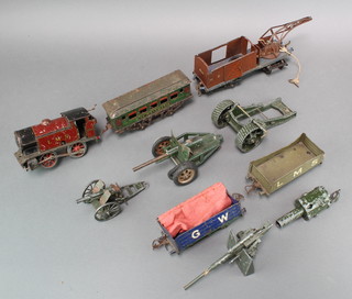 A Horny clockwork locomotive tank engine (f) and a small collection of rolling stock - all play worn, together with a collection of model field guns 