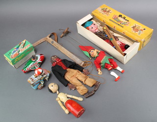 A Pelham puppet boxed, 3 other puppets, an Italian clockwork ice cream vendor, a Chinese Friction type tin plate model racing car  