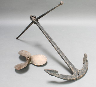 A Fisherman's iron anchor 39" x 39" together with a bronze 3 bladed propellor 16" 