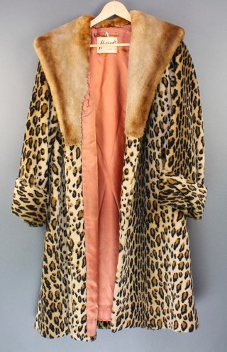 A lady's 1950's full length simulated leopard skin coat with fur collar retailed by Harrods 

