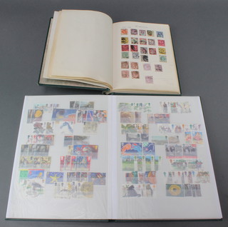 A stock book of GB stamps including penny reds, a green album of GB stamps including tuppeny blue, penny reds Victoria to Elizabeth II 