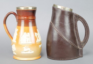 A Doulton Lambeth leatherwork jug with silver collar London 1891 9" and a stoneware jug with silver collar 9" 
