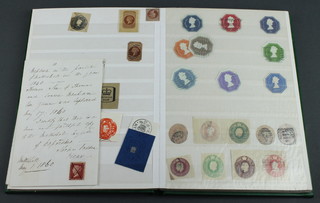 A green album containing a penny black, 6 penny reds, 3 penny blues, 5 penny reds affixed to letters and Victorian and later GB stamps 

