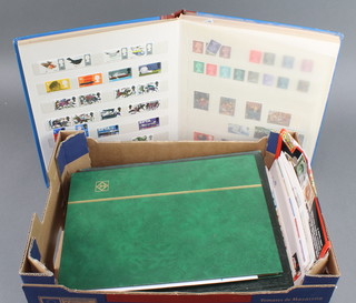 A stock book of various GB mint stamps, Edward VII - Elizabeth II, an album of French stamps 1938 -1973, a stock book of World stamps, various GB presentation stamps and first day covers