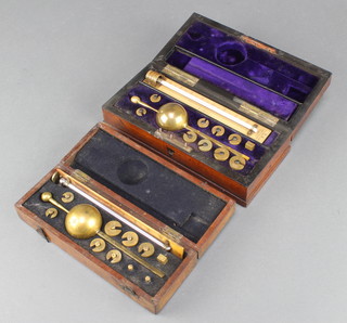 A Sykes hydrometer no.11277 contained in a mahogany case (slight dent to main body and missing magnifying glass) together with 1 other no.13666 in a mahogany case (missing magnifying glass and the lid has been gently forced) 