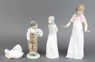 A Nao figure of a boy holding a football 7 1/2", a ditto of a girl 8", another of 2 geese 4" and a girl with chamber stick 10" 