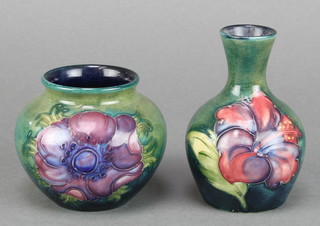 A Moorcroft oviform vase decorated with flowers 3 1/2" together with a ditto baluster vase 3" 