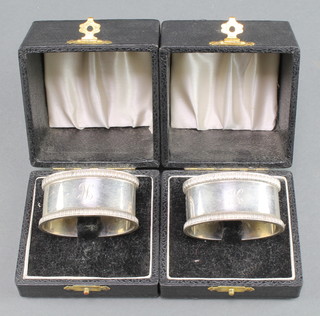 A pair of cased silver napkin rings Birmingham 1958 76 grams 