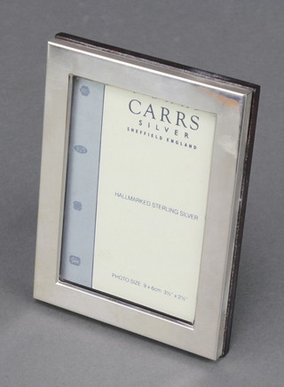 A rectangular Sterling silver photograph frame 4" x 3" boxed 