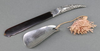 A silver shoe horn Chester 1931 and a silver mounted paper knife 