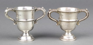 A pair of silver 2 handled trophy cups Sheffield 1930/38 3", 70 grams 