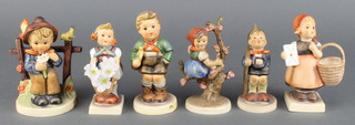 A Hummel figure - Meditation 4", She Loves Me - She Loves Me Not 174 4", Little Hiker 76 4", a do. girl in an apple tree, a boy with a trumpet and a girl with a basket 
