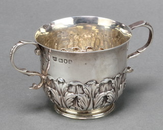 A silver porringer with acanthus decoration London 1903? 106 grams 
