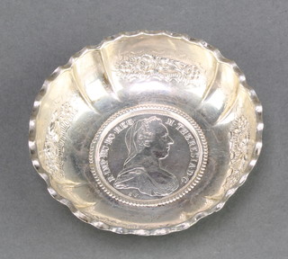 A Continental repousse silver dish with coin set base 70 grams 