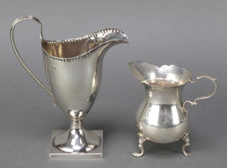 A Victorian silver cream jug Chester 1896 and a Georgian style ditto 158 grams