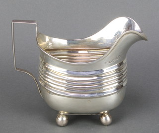 A George III silver milk jug on ball feet London 1807, 190 grams 