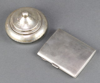 A silver engine turned cigarette case Birmingham 1950 88 grams and a silver toilet jar 