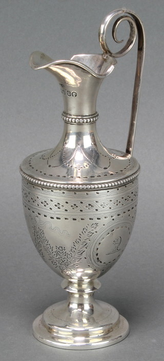 A Victorian silver ewer with chased floral decoration London 1873 7", 188 grams 