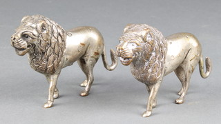 Two silver plated figures of standing lions 4 1/2" 
