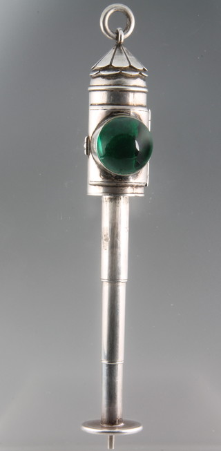 A Victorian novelty silver propelling pencil in the form of a police bullseye lantern, the body with a circular domed glass magnifying lens with green floral background and 3 draw stem, engraved Thornhill 4 1/2" 