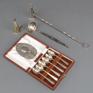 A silver candle snuffer, a snuffer end, a repousse wall light, 6 cased silver tea spoons and a silver ladle with whalebone handle 174 grams 