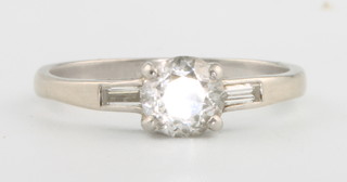 A white gold single stone diamond ring approx 0.5ct flanked by tapered baguette diamonds size J 