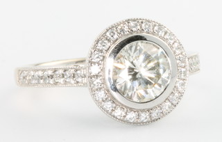 An 18ct white gold single stone diamond ring approx. 1.06ct surrounded by brilliant cut stones approx. 0.35ct size K 1/2