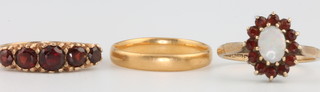 A 22ct yellow gold wedding band, size M 2.6 grams, 2 9ct gold gem set rings size N and O