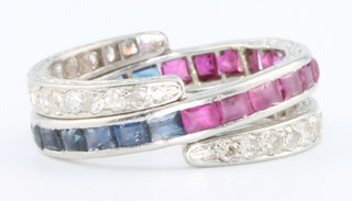 A white gold triple fold over eternity ring with sapphires, diamonds and rubies, size L 