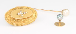 An Edwardian 15ct yellow gold diamond and pearl set etruscan brooch, a pearl tie pin and a stud