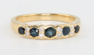 An 18ct yellow gold sapphire and diamond half eternity ring size K 1/2