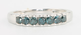 A 9ct white gold blue diamond ring size N 
