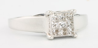 A 9ct white gold princess cut diamond ring size N 1/2