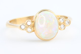 An 18ct yellow gold opal and diamond ring, size O 