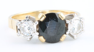 An 18ct yellow gold sapphire and diamond ring size N 1/2