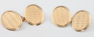 A pair of 9ct yellow gold engine turned cufflinks 3.8 grams 