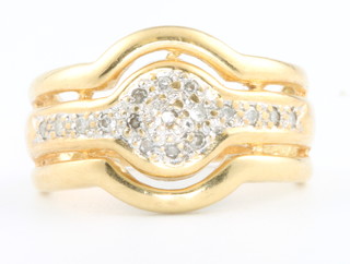 An 18ct yellow gold diamond set open ring size M 1/2