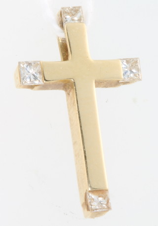 An 18ct yellow gold diamond set cross