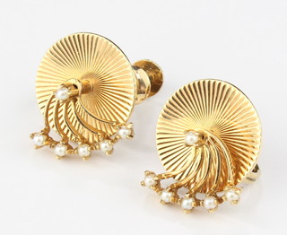 A pair of yellow gold seed pearl set ear clips, marked Cartier 25616 in a fitted Cartier box
