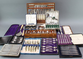 An oak canteen of plated cutlery, a cased pair of plated fish servers, 1 other and 8 cased sets