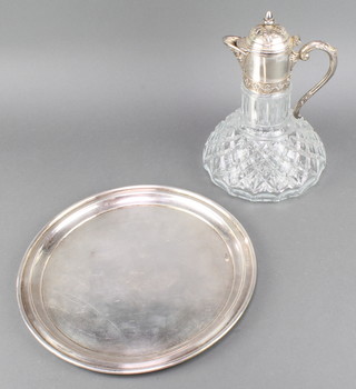 A silver plated circular tray and a ditto mounted ewer