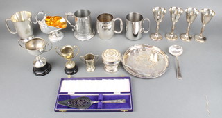 2 silver plated trophy cups, a silver plated sugar scuttle and minor plated items 
